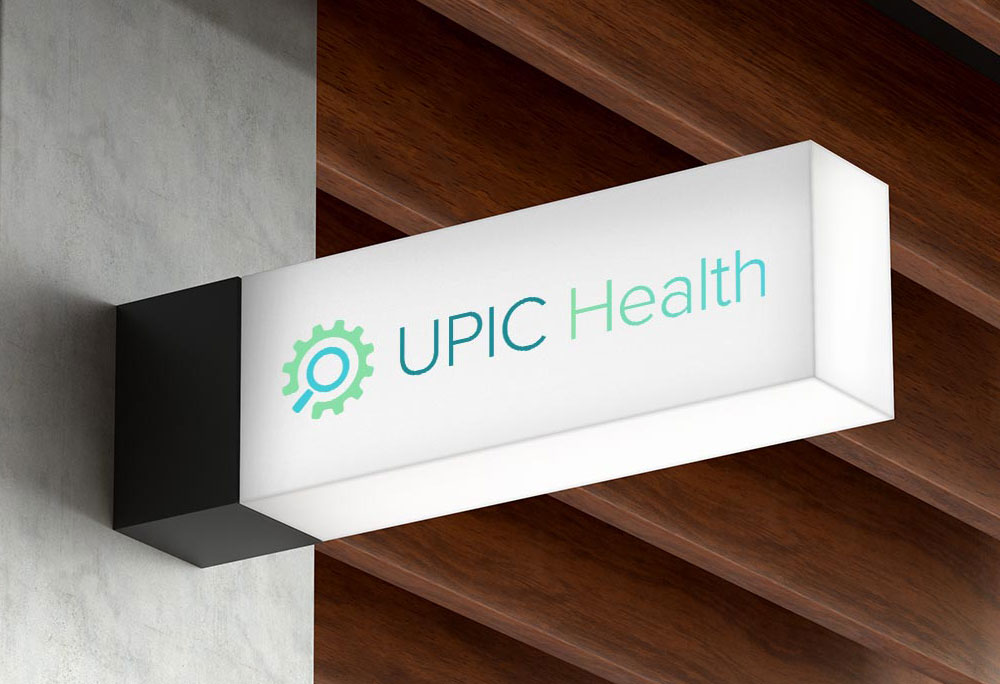 A hanging wall sign with UPIC Health printed on it.